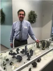  ?? Patricia Dillon ?? Jeffrey Anolik, owner of Jeffrey and Company Jewelers, a jewelry store that specialize­s in Victorian-era and estate jewelry, stands beside a display case. The store opened its doors the first of December in Crossroads Square at Creekside Park in The...