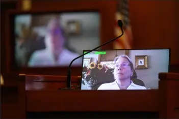  ?? / Getty Images ?? Disney Executive Tina Newman appears on a monitor in a February recorded deposition played during the 50 million U.S. dollar Depp vs Heard defamation trial at the Fairfax County Circuit Court in Fairfax, Va., on Thursday.