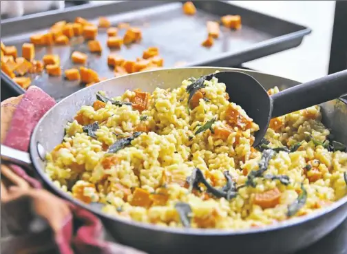  ?? Gretchen McKay/Post-Gazette photos ?? Saffron-flavored risotto cooked with butternut squash and topped with fried sage.