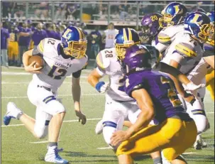  ?? The Sentinel-Record/Grace Brown ?? RAM RECOVERY: Lakeside quarterbac­k Taylor Gillham (12) charges into the end zone Friday during the Rams’ 40-27 loss at Fountain Lake.