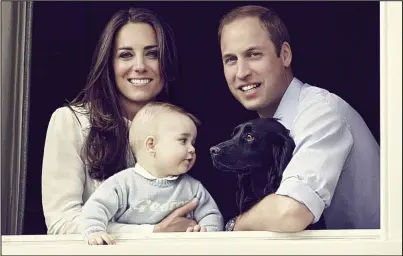  ??  ?? ‘Not extravagan­t’: The Duke and Duchess with Prince George and dog Lupo at their apartment window