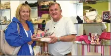  ??  ?? Tim Horgan, Shoes 4 U, Plunkett Street, Killarney showing customer Jacinta Sheehan, Killorglin a selection of ladies footwear.