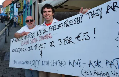  ??  ?? John Holstead and Gary Curran at the Rugbaí Chorca Stand where the 1,000 fresh oysters they had for the weekend sold out on Saturday afternoon. Maybe their customers were inspired by the Rugby World Cup, maybe by the promise on the poster.