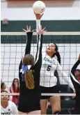  ?? RECORDER PHOTO BY CHIEKO HARA ?? Lindsay High School's Berenise Rangel spikes over a Corcoran High School block Wednesday during the first set at Lindsay.