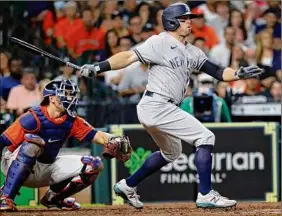  ?? Bob Levey / Getty Images ?? Brett Gardner of the Yankees doubles in two runs in the fourth inning against Houston on Friday. It was all the offense New York needed.