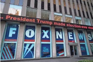  ?? MARK LENNIHAN/AP FILE ?? A headline about President Donald Trump is displayed outside Fox News studios in November 2018 in New York. Attorneys for the cable news giant argued in a countercla­im unsealed Thursday that a $1.6 billion defamation lawsuit against Fox News by Dominion Voting Systems over the network’s coverage of the 2020 presidenti­al election is an assault on the First Amendment.