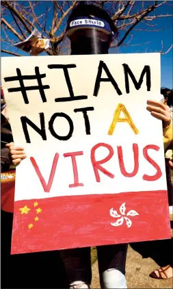  ?? GENARO MOLINA/LOS ANGELES TIMES ?? A person holds a sign at a rally to raise awareness of anti-Asian violence at Los Angeles State Historic Park on February 20.