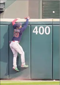  ?? Jonathan Daniel / Getty Images ?? Red Sox outfielder Alex Verdugo climbs the wall as a ball hit by Chicago’s Leury Garcia clears it in the ninth inning on Sunday in Chicago.