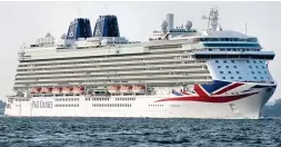  ??  ?? Regal: Cruise ship Britannia. Right: Rescued migrants with Spanish Red Cross staff yesterday