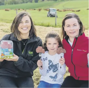  ??  ?? 0 Asda’s Heather Turnbull, left, with Carlyn Paton and her eight-year-old daughter Daniella