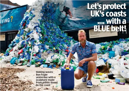  ??  ?? Making waves: Ben Fogle yesterday with a sculpture made from plastic found by the coast