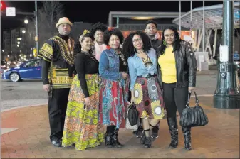  ?? Sait Serkan Gurbuz ?? The Associated Press The Lawton family wears traditiona­l African clothing to a showing of new superhero movie “Black Panther” Thursday in Silver Spring, Md.