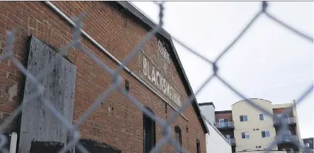  ?? IAN KUCERAK ?? The former A. Minchau blacksmith shop, first opened in 1925, is located at 101 Street and 81 Avenue. The building, slated to be demolished, has landed on a National Trust of Canada endangered list.