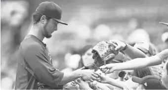  ?? CHARLES LECLAIRE/USA TODAY SPORTS ?? Cubs pitcher Yu Darvish signs autographs before playing the Pittsburgh Pirates at PNC Park.