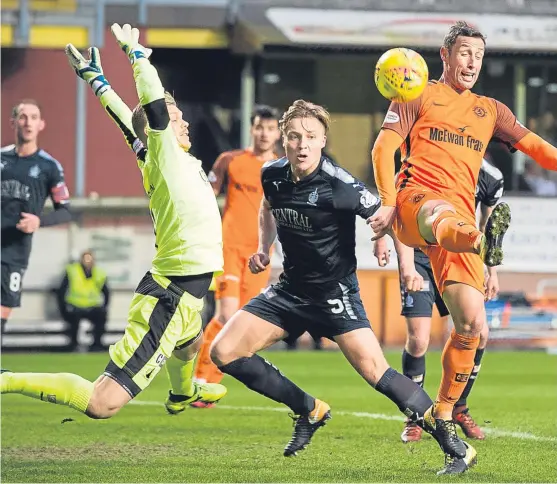  ?? Picture: SNS Group. ?? Dundee United’s Scott Mcdonald hooks the ball past goalkeeper Robbie Thomson and into the Falkirk net to open the scoring in yesterday’s 3-0 win at Tannadice.