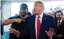  ?? Photograph: Alex Brandon/AP ?? Former UFC fighter Jorge Masvidal gestures towards Donald Trump as he visits Versailles restaurant in Miami on Tuesday.