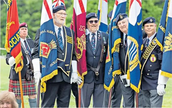  ?? ?? Royal British legion standard bearers at the service. Among those attending was Sara Jones, widow of Colonel H Jones, who died during the battle for Goose Green