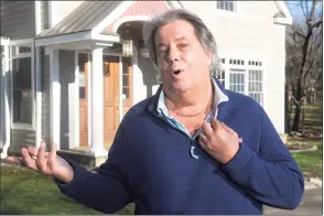  ?? Ned Gerard / Hearst Connecticu­t Media ?? COVID-19 survivor Alan Fedor shows a scar on his throat left by surgery to correct damage from a wound caused by a ventilator that didn’t heal correctly. Fedor stands in front of his Norwalk home on Dec. 10.