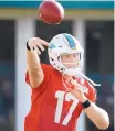  ?? AP FILE ?? Dolphins QB Ryan Tannehill reinjured his left knee in practice Thursday, and his status for the season is unknown.