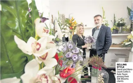  ??  ?? SELLING STYLE David and Mara count Celtic’s Kolo Toure among their Silk Blooms clients