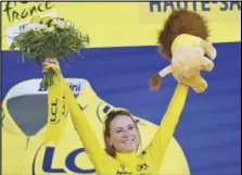  ?? Associated Press ?? Netherland’s Annemiek Van Vleuten celebrates on the podium after winning the Tour de France women’s cycling race, Sunday, in La Super Planche des Belles Filles, eastern France.