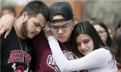  ??  ?? Students comfort each other at Desert View high school in Tucson, Arizona Monday. Photograph: Mamta Popat/AP