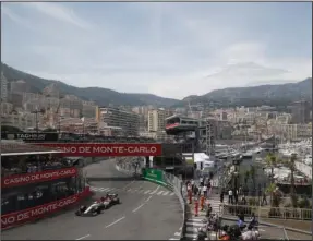  ?? The Associated Press ?? LEGENDARY RACE MEET: In this Saturday, May 25, 2019, file photo, Alfa Romeo driver Kimi Raikkonen of Finland steers his car during the qualifying session at the Monaco racetrack, in Monaco. Formula One’s raucous circus won’t be coming on May 24 for the iconic Monaco Grand Prix. The race was canceled on March 19 because of the coronaviru­s outbreak, with the jewel in F1’s crown removed for the first time in 66 years.