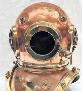  ??  ?? A twelve-bolt copper diver’s helmet, which sold for £3,000