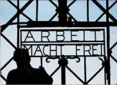  ?? MATTHIAS SCHRADER/AP 2015 ?? A replica of the Dachau concentrat­ion camp gate was installed in the missing gate’s place for last year’s event.
