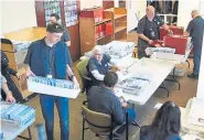  ?? RJ Sangosti, The Denver Post ?? Election judges process incoming ballots at Denver election headquarte­rs during Colorado’s Super Tuesday presidenti­al primary.