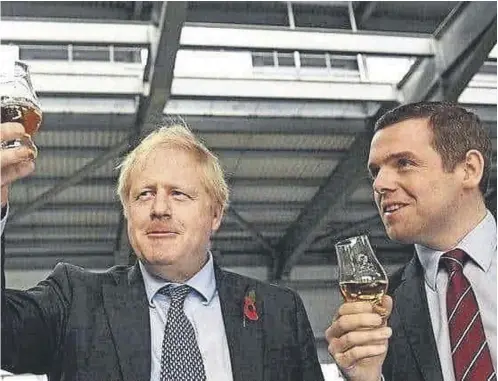  ?? ?? ↑ Former prime minister Boris Johnson and Douglas Ross enjoy a dram