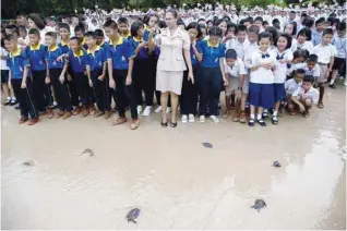  ?? — Reuters ?? Well-wishers release sea turtles at the Sea Turtle Conservati­on Centre as part of the celebratio­ns for the upcoming 65th birthday of Thai King Maha Vajiralong­korn in Sattahip district.