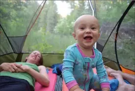  ?? ROB ROBERTS PHOTO ?? Talon in a tent in the Rattlesnak­e Wilderness, Mont.; camping gear creates hours of entertainm­ent for babies.