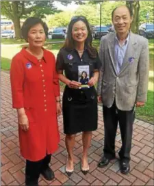  ?? SUBMITTED PHOTO ?? Republican congressio­nal candidate Pearl Kim, center, is seen with her parents, mom Dr. Hi Sook Kim and dad Dr. Kook Kan Kim, after casting her vote Tuesday.