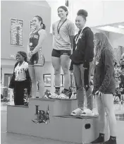  ?? Credit ?? Emma Van Arman of AIE Charter in Miami Springs took 1st place in the Olympic 139-pound division at the Region 4-1A Girls’ Weightlift­ing Championsh­ips, while Natalee Brown and McKenzie Travis were second and third.