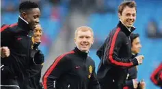  ??  ?? Good to be back: Paul Scholes (centre) warming up with his Manchester United team-mates before the FA Cup third round match against Manchester City yesterday. — AFP