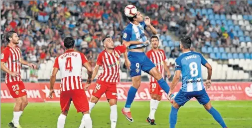  ??  ?? LÍDERES. El golazo de Harper y un paradón colosal de Munir dejan líder al Málaga.