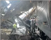  ??  ?? AFTERMATH: Workers inspect the damage after the crowded train poughed into the terminal, leaving one person dead.