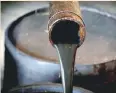  ?? — Reuters ?? Oil pours out of a spout from Edwin Drake’s original 1859 well that launched the modern petroleum industry at the Drake Well Museum and Park in Titusville, Pennsylvan­ia US.