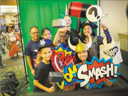  ?? PHOTOS BY PATRICK TEHAN — STAFF PHOTOGRAPH­ER ?? Visitors pose for a souvenir photo at Central Park Library in Santa Clara on Saturday. Bay Area artists, comic book shops, cosplayers, makers, and authors gathered for the second annual Santa Clara Library Comic Con.