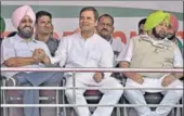  ?? GURPREET SINGH/HT ?? HAND IN HAND Congress president Rahul Gandhi with senior party leader Partap Singh Bajwa at a rally in Khanna on Monday. Punjab CM Amarinder Singh is also seen.