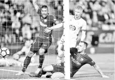  ??  ?? Barcelona’s Spanish forward Paco Alcacer (R) scores a goal beside Celta Vigo’s Danish midfielder Daniel Wass (C) and Barcelona’s Brazilian midfielder Paulinho during the Spanish league football match between Celta de Vigo and FC Barcelona at the...