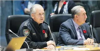  ?? WAYNE CUDDINGTON FILES ?? Chief Charles Bordeleau, left, and police board chair Coun. Eli El-Chantiry, seen during police budget deliberati­ons at city hall in November.