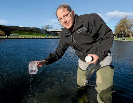  ?? PHOTO: SCOTT HAMMOND/FAIRFAX NZ ?? Council environmen­tal scientist Steffi Henkel samples water quality at the Taylor River.