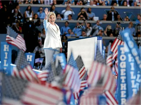  ?? PHOTO: REUTERS ?? Hillary Clinton waves after she accepted the Democratic presidenti­al nomination on the fourth and final night of the national convention in Philadelph­ia.