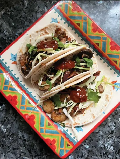  ?? GRETCHEN MCKAY — PITTSBURGH POST-GAZETTE/TNS ?? The vegetarian “chorizo” tacos are made with highly seasoned mushrooms.