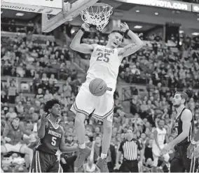  ?? [KYLE ROBERTSON/DISPATCH] ?? Kyle Young, dunking against Minnesota on Jan, 23, became a fan favorite for his gritty and passionate play.