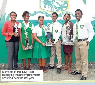  ??  ?? Members of the ISCF Club displaying the accomplish­ments achieved over the last year.