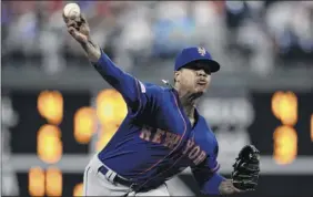  ?? Matt rourke / Associated Press ?? mets starting pitcher marcus Stroman got a no-decision. He gave up two runs on seven hits, striking out six and working into the seventh inning.