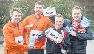  ?? Pic: EYE IMAGERY ?? Calling all Joneses... Kyle MacKenzie, Jack Robertson, Always Aim High MD Tim Lloyd and Jones Crisps Director Geraint Hughes publicisin­g the world record attempt for runners with that surname